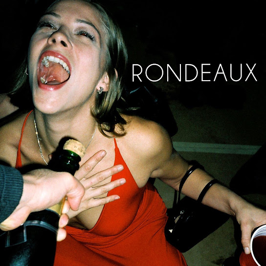 Rondeaux album cover: a flash photograph of a woman in a red dress
